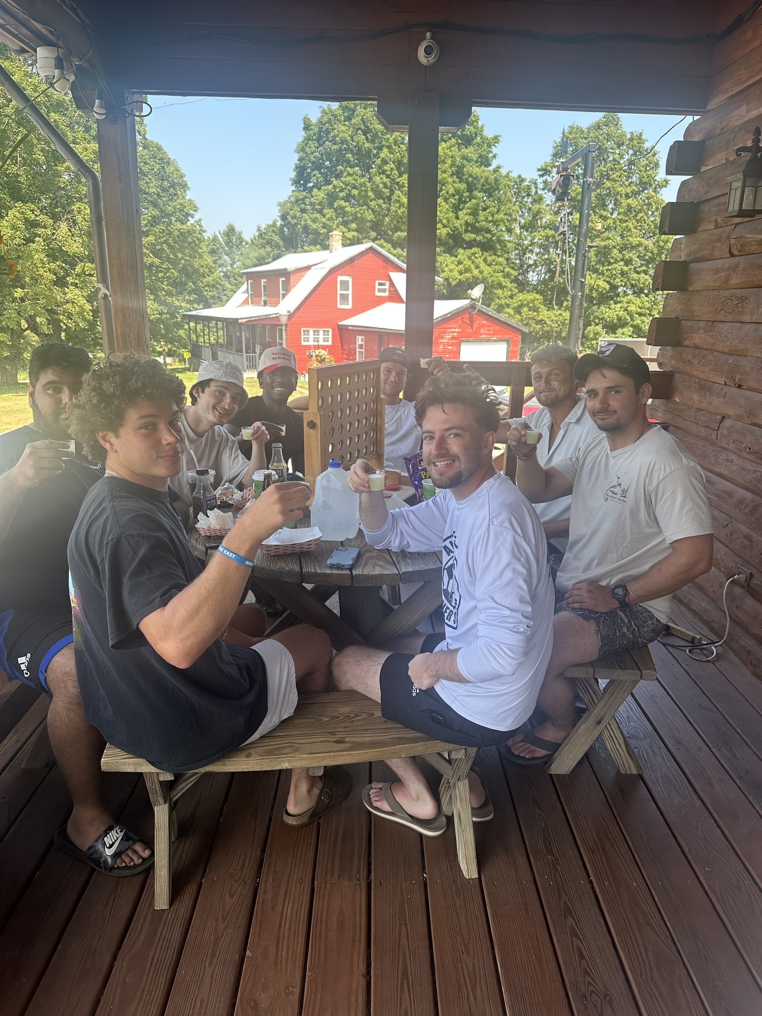 Group of friends eating on the porch